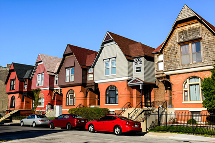 Distinctive Queen Anne style houses, with parked cars