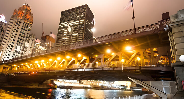 Chicago riverwalk and DuSable bridge at night in City of Chicago.