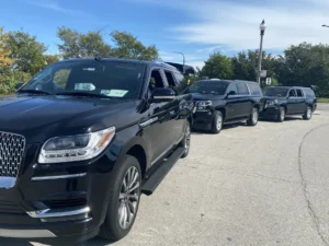 Three Luxury SUvs on Road