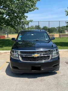 Our Luxury Chevy Suburban stands outside a garden