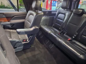 Interior of luxury full size suv with both captain and bench seating