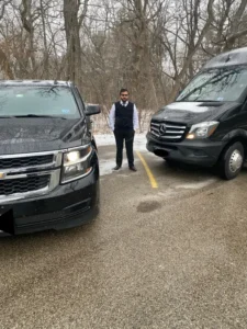 Our Chauffeur Stands in front of luxury Mercedes Sprinter Van