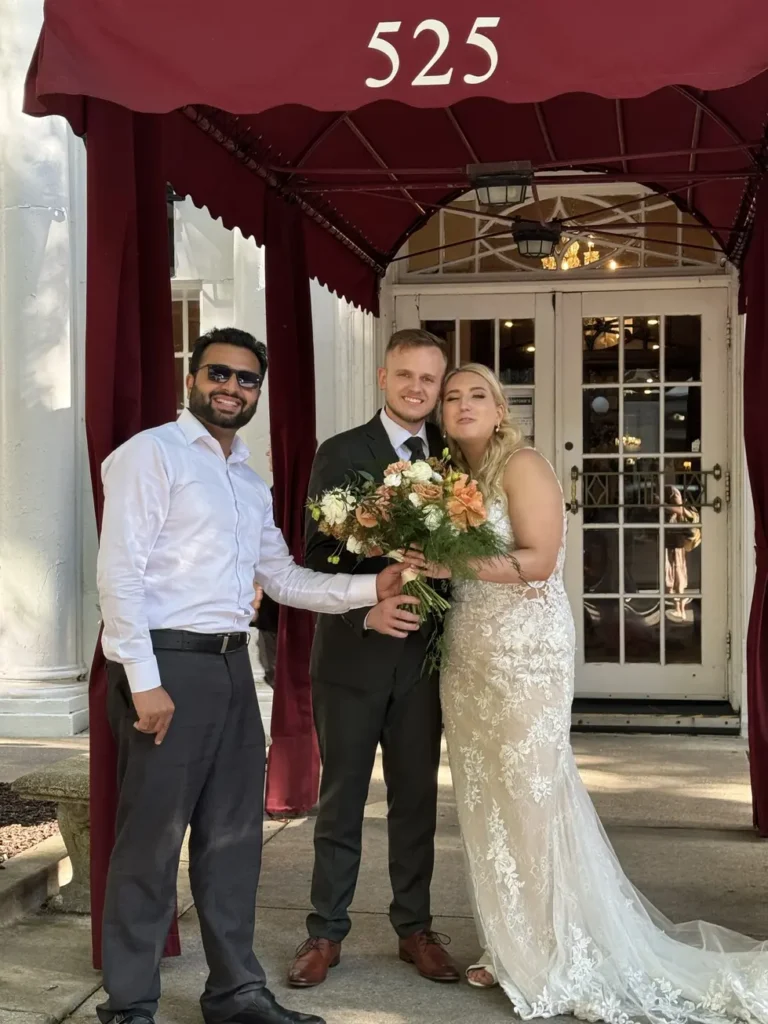 Our Chauffeur Congratulates Wedding Coup giving them Flowers